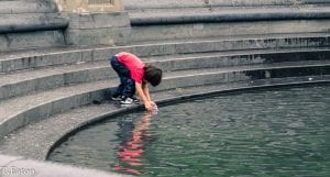 kid playing in water